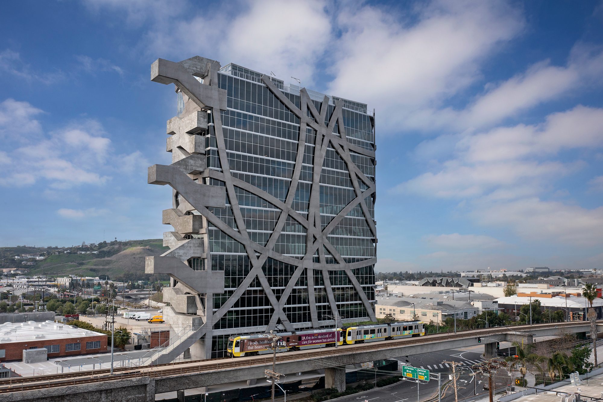 The (W)rapper tower in Los Angeles, with curved structural bands around its glass exterior